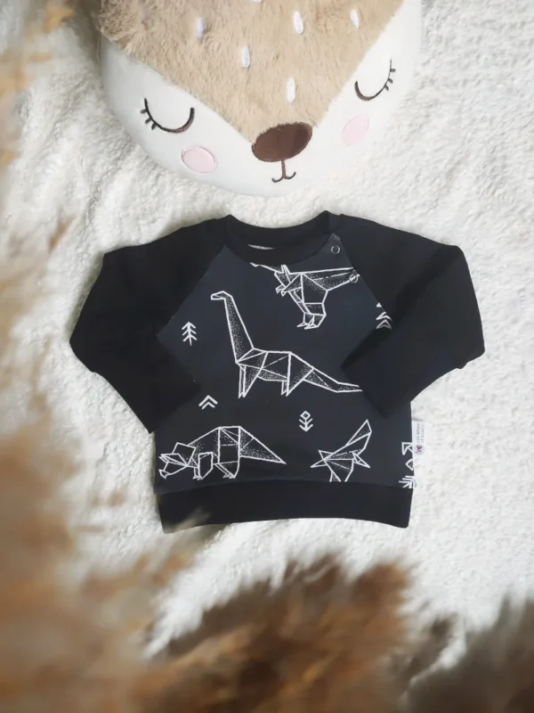 Sweat évolutif en coton bio, taille 3-12 mois, avec un motif dinosaure sur fond noir, doux et confortable pour accompagner bébé au quotidien.
